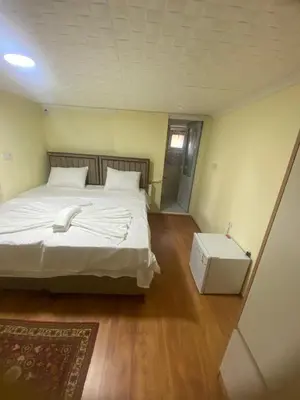 a bedroom with a large bed and a white box at Muhterem Hanım Konağı in Istanbul
