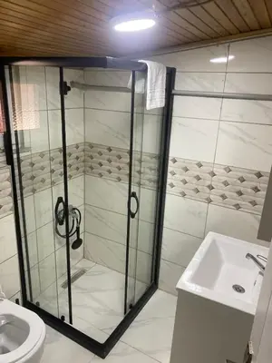 a shower in a bathroom with a toilet and a sink at Muhterem Hanım Konağı in Istanbul