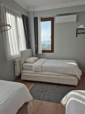 a bedroom with two beds and a window at Villa منظر in Sapanca