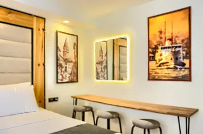a hotel room with a bed and a desk at Vita Otel in Istanbul