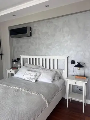 a bedroom with a white bed and a white table at Villa Maya Serdivan in Serdivan