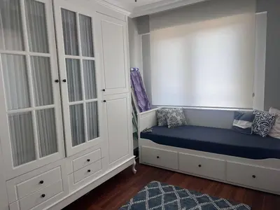 a bedroom with a bed and a window with a window seat at Villa Maya Serdivan in Serdivan