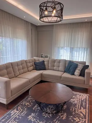 a living room with a couch and a table at Villa Maya Serdivan in Serdivan