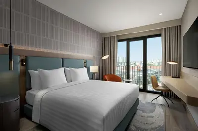 a hotel room with a bed and a desk at Marriott Executive Apartments Istanbul Tema World in Istanbul