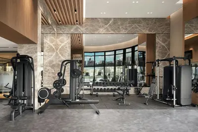 a gym with cardio equipment in a hotel room at Marriott Executive Apartments Istanbul Tema World in Istanbul