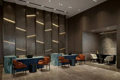 a lobby with a row of tables and chairs at Marriott Executive Apartments Istanbul Tema World in Istanbul