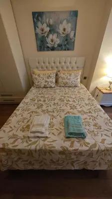 a bedroom with a bed with two towels on it at An İstanbul tale, İstanbul dream,bosphorus villa in Istanbul
