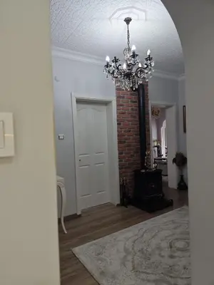 a room with a chandelier and a brick wall at An İstanbul tale, İstanbul dream,bosphorus villa in Istanbul
