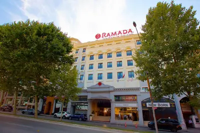 a large building with a sign on top of it at Ramada by Wyndham Istanbul Merter in Istanbul