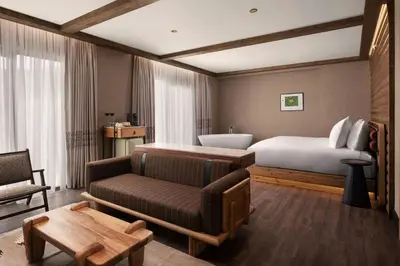 a hotel room with a bed and a couch at Ceylan Splend'or Uludag, Autograph Collection