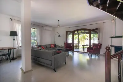 a living room with a couch and chairs and a table at 4BR all AC Pool BBQ Garden on Bagdat Ave Kirkpinar in Sapanca