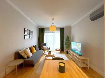 a living room with a couch and a table at Taksim360 Residences in Istanbul