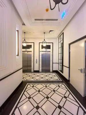 a hallway with doors and a tiled floor at Taksim360 Residences in Istanbul
