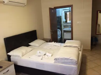 a bedroom with a bed with towels on it at Hotel Kiwi in Istanbul