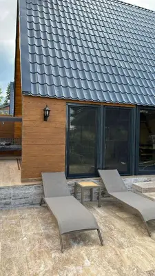 a group of chairs and tables in front of a building at Finymoco in Kartepe