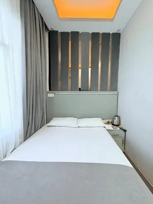 a bedroom with a white bed and a window at Crowned Boutique Hotel in Istanbul