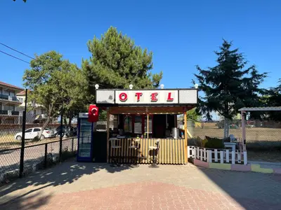 a small gas station with a sign on it at Kumbağ Otel in Kumbağ