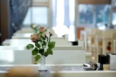 a vase with flowers in it on a table at The Hera Premium Hotels in Istanbul