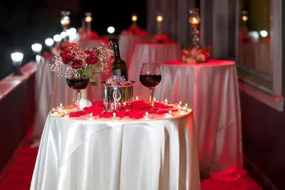 a table with wine glasses and wine bottles on it at The Hera Premium Hotels in Istanbul