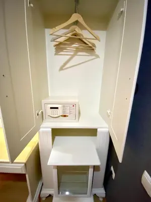 a closet with a white cabinet and a microwave at Santefe Hotel in Istanbul