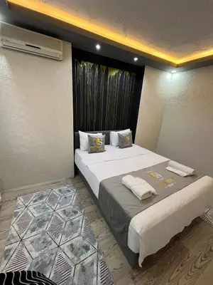 a hotel room with two beds with towels on them at Poyraz suit in Bursa