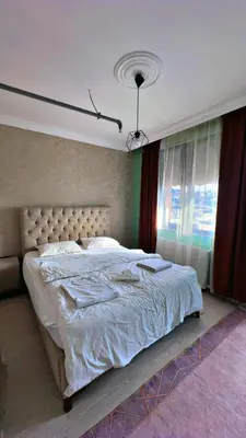 a bedroom with a large bed and a window at 216 Blue Life in Istanbul