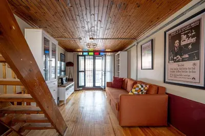 a living room with a couch and a wooden ceiling at Mercan Apartments Balat-The Hidden Terrace in Istanbul