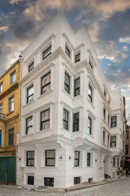 a white building with windows on a street at Boutique 360 Suite in Istanbul