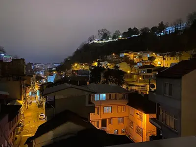 a view of a city at night with buildings at Poyraz suit in Bursa