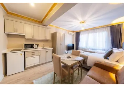 a living room with a couch and a table at Taksim Studio Apart in Istanbul