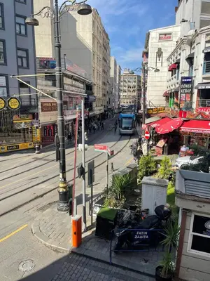a busy city street with buildings and a street light at Mery Hotel İstanbul in Istanbul