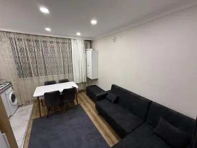 a living room with a couch and a table at Galata Green Apple Apart in Istanbul