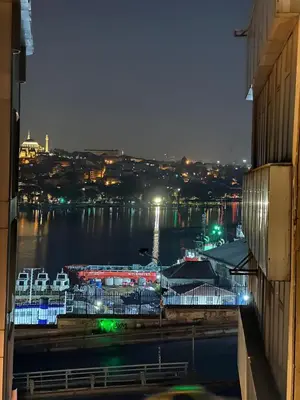 a view of a harbor at night with a marina at Galata Green Apple Apart in Istanbul