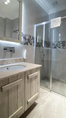 a bathroom with a sink and a shower at Magical House Hotel in Çatalca