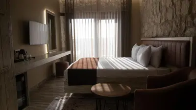 a hotel room with a bed and a window at Magical House Hotel in Çatalca