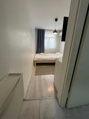 a small room with a bed and a window at Şişli Suites - Room45 in Istanbul
