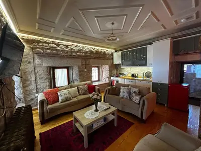 a living room with two couches and a table at Welcome to the presence of history! in Istanbul
