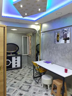 a room with a white table and a kitchen at Hilal Aparment Basement in Istanbul