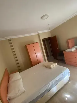 a bedroom with a bed and a dresser at Otel in Kumbağ