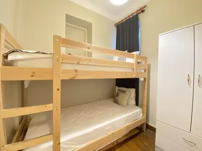 a couple of bunk beds in a small room at Charming Vintage 3BR in the Heart of Beyoğlu in Istanbul