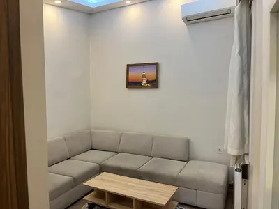 a living room with a couch and a table at Mutlu flat in Istanbul