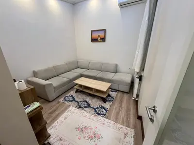 a living room with a couch and a table at Mutlu flat in Istanbul