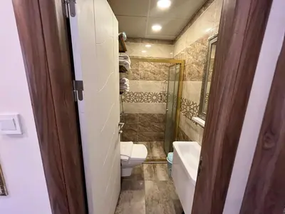 a bathroom with a toilet and a sink at Mutlu flat in Istanbul