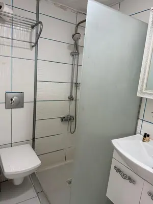 a bathroom with a toilet and a sink at Holiday Suit in Istanbul