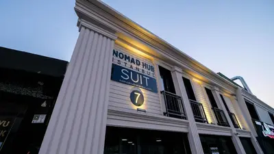a building with a sign on the side of it at Nomad Hub Suit İstanbul in Istanbul