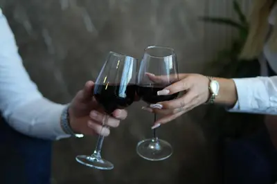 two people holding glasses of red wine at Kent Room Hotel in Kapaklı
