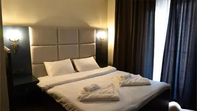 a hotel room with a bed with towels on it at Miller Home's in Istanbul