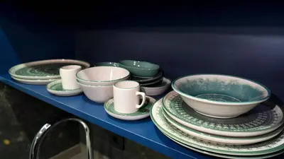 a blue shelf with plates and cups and bowls at Miller Home's in Istanbul
