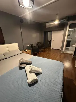a bedroom with a bed with two towels on it at Besiktas Guest House in Istanbul
