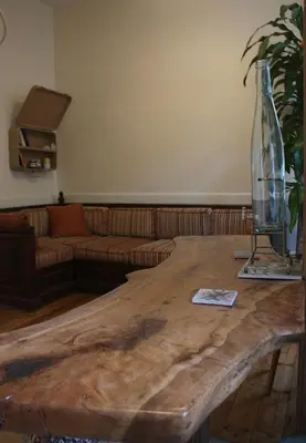 a living room with a wooden table and a couch at Stunning 5 Bedroom Sunlit Apartment Galata in Istanbul